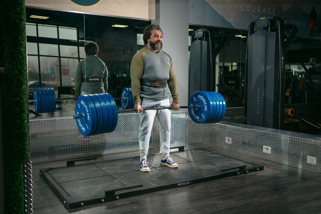 Man performing deadlift at Gold's Gym Vancouver
